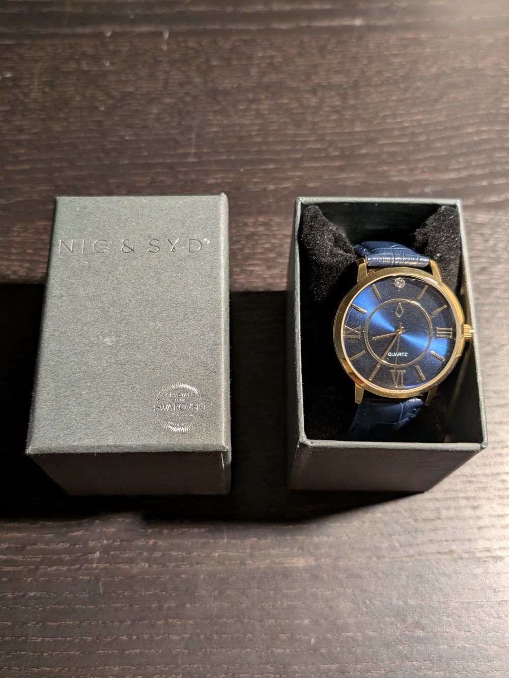 Swarovski Men’s Blue Dial Gold-Tone Case Watch